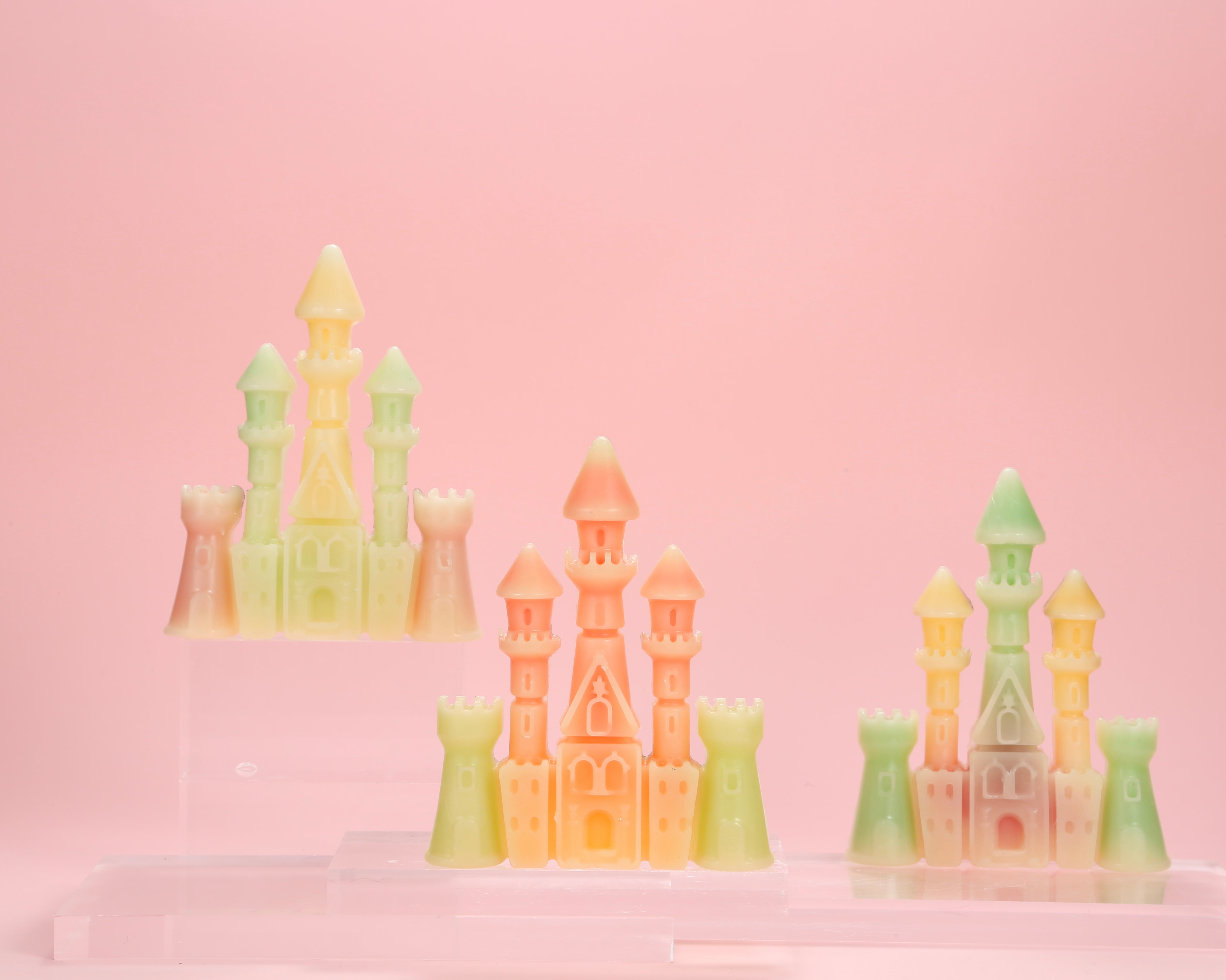 Two large castle shaped wax bottle candies by Oodles filled with fruit juice