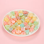 Classic one-bite wax bottle candies by Oodles in various colors filled with fruit juice