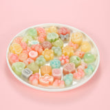 Classic one-bite wax bottle candies by Oodles in various colors filled with fruit juice
