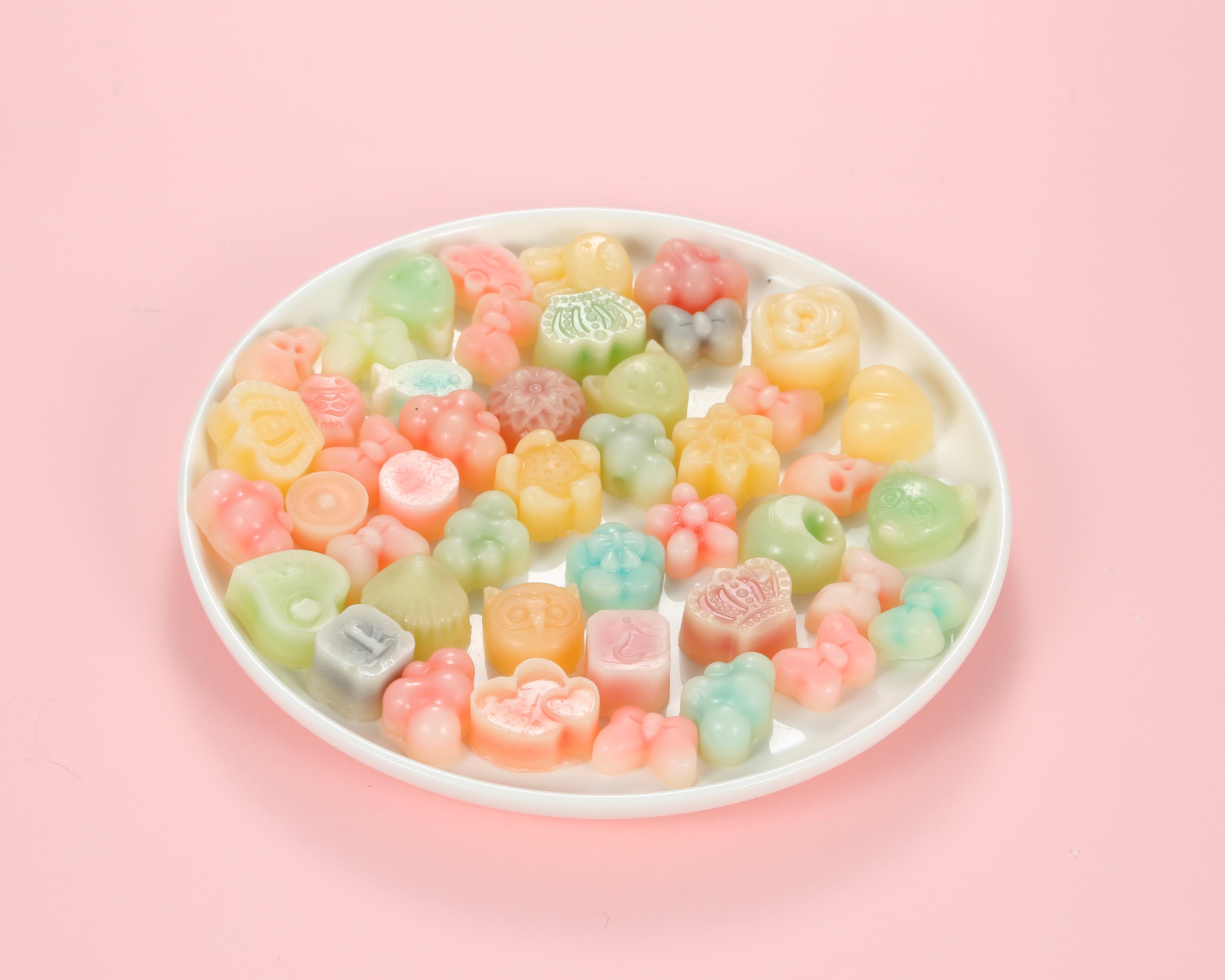 Classic one-bite wax bottle candies by Oodles in various colors filled with fruit juice