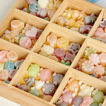 Mini wax bottle candy pieces showing colorful fruit juice filling inside