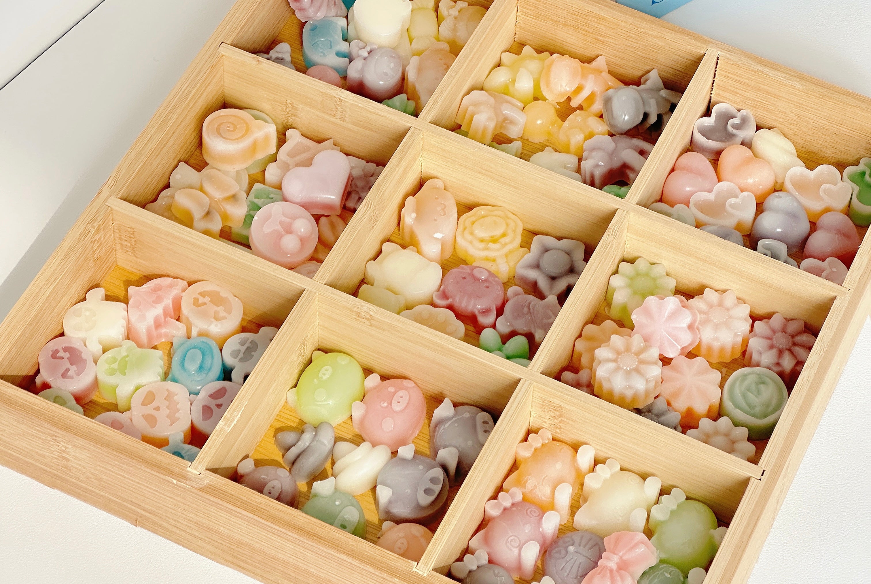 Mini wax bottle candy pieces showing colorful fruit juice filling inside